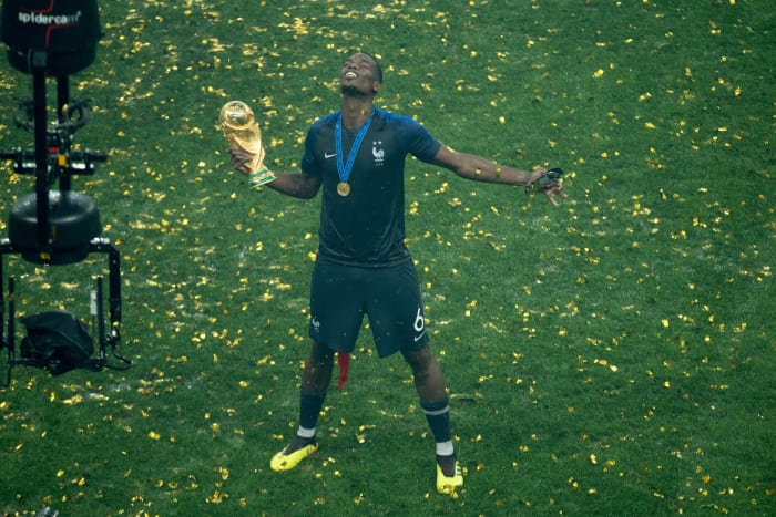 Paul Pogba pictured holding the World Cup trophy after helping France beat Croatia in the 2018 final